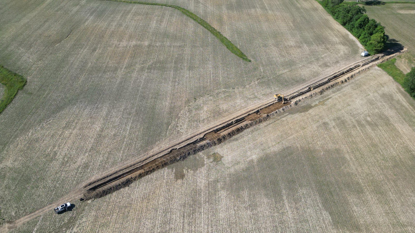 Aerial view of a petroleum products pipeline staged for a lowering project